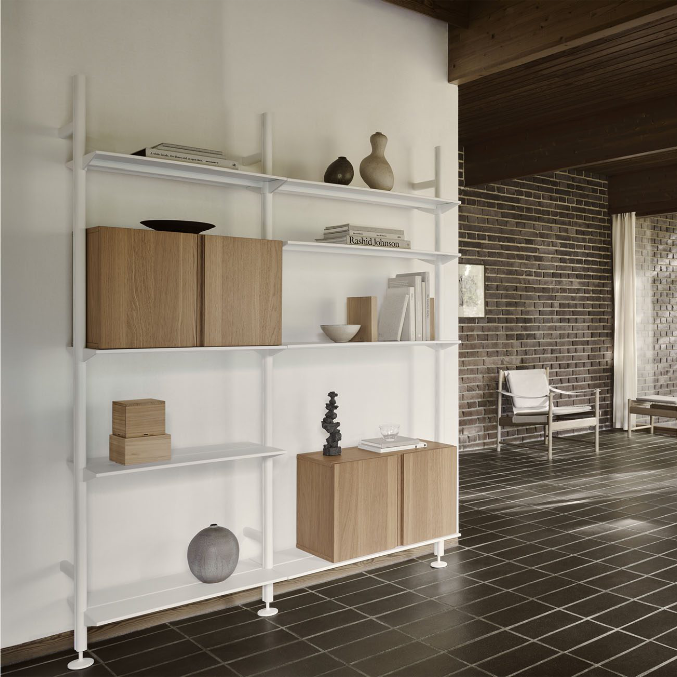 Modern shelving unit with wooden storage compartments in a room with tiled floor and brick wall.