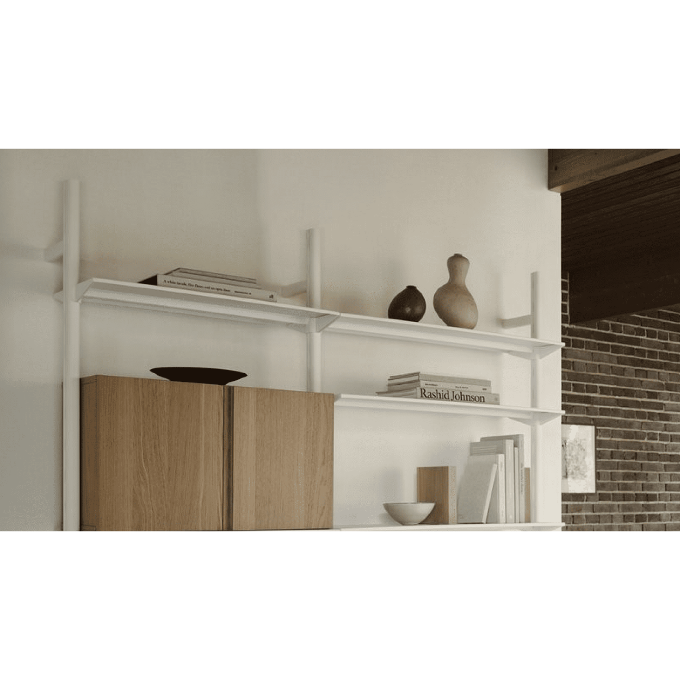 Modern interior with a white shelf unit and wooden cabinet.